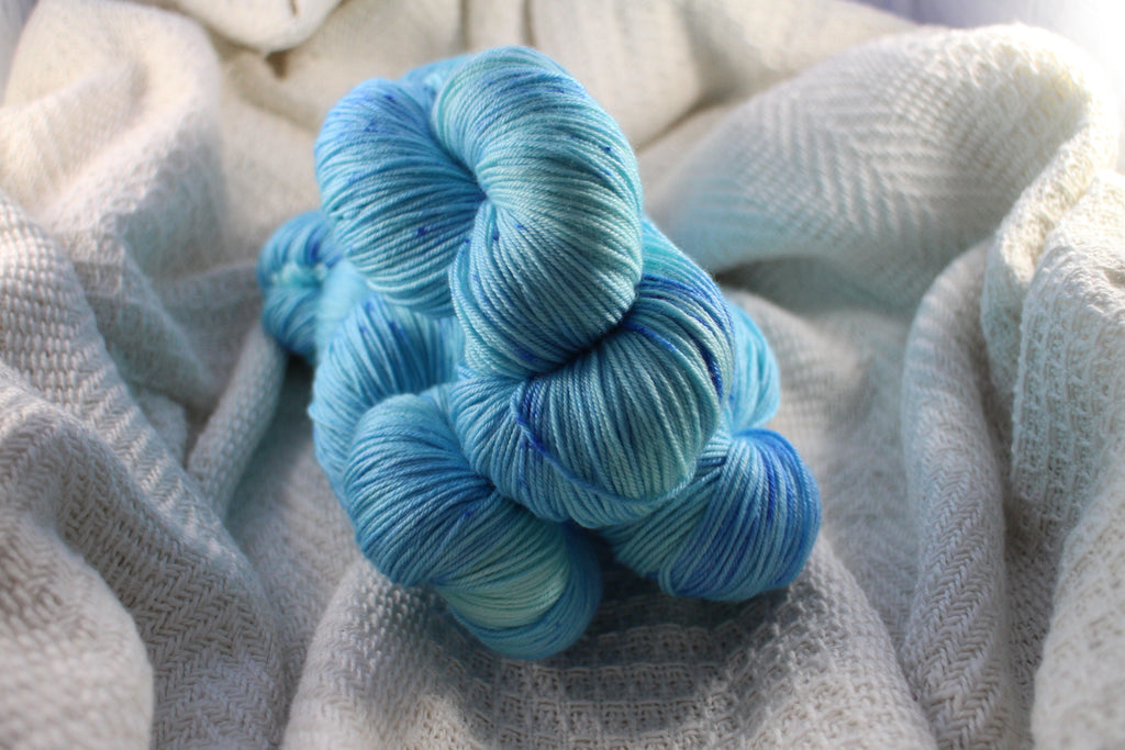 3 skeins of Crates of Wool Mulberry 4ply in blue